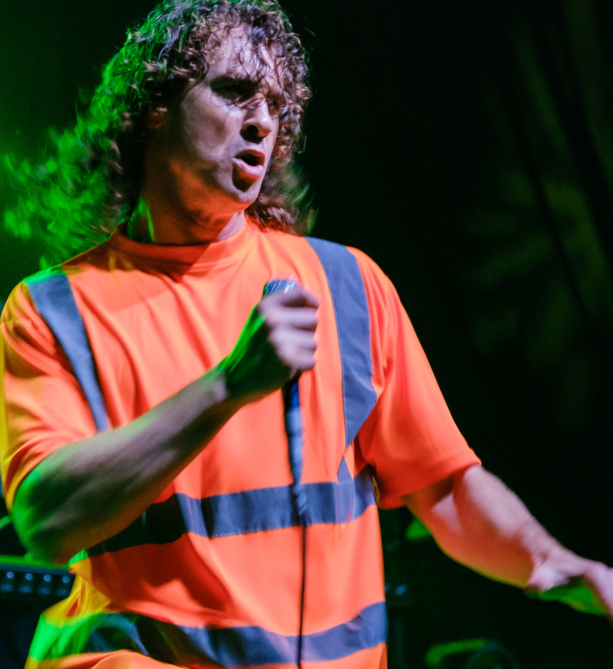 Rob from Don Broco dancing on stage.