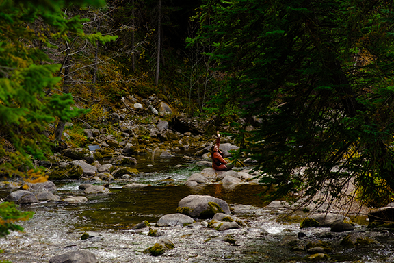 My friend Elaine waving in the river in Vail.